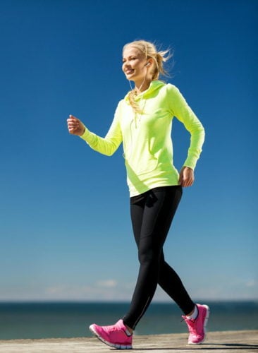 fitness and lifestyle concept - woman doing sports outdoors